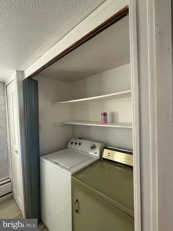 a utility room with washer and dryer