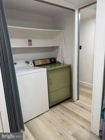 a large bed in a large room with a large window