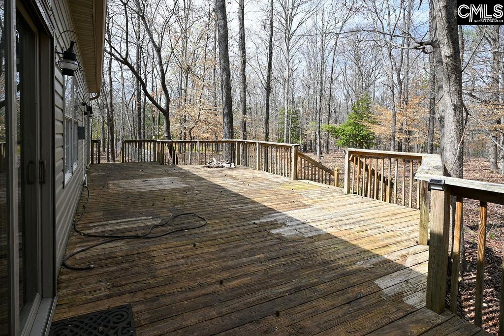 88 Running Deer Road Blythewood, SC 29016 - Photo 18 of 24 a view of a balcony with wooden floor and fence