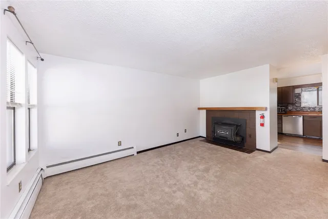 an empty room with a fireplace