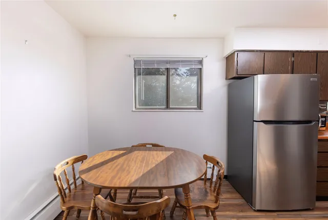 a dinning room with a table and chairs