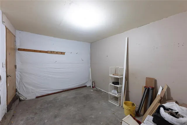 a view of a patio with a table chairs and a fire pit