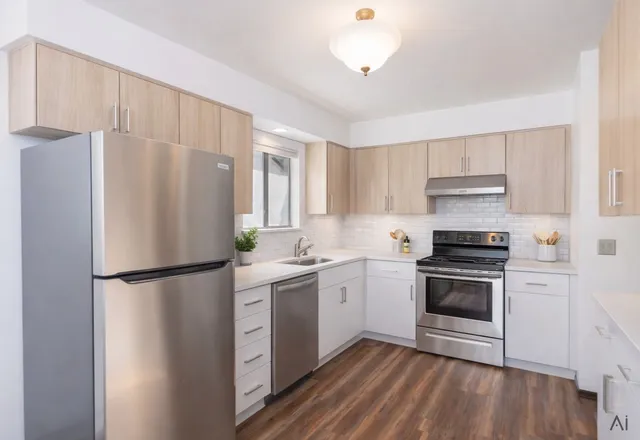 a kitchen with a refrigerator sink and stove