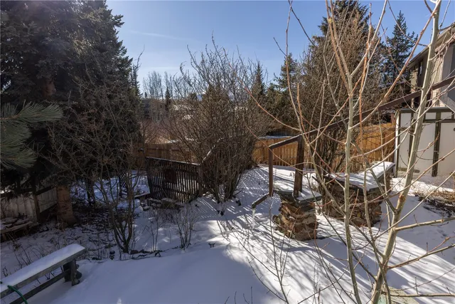 a view of a bench in a backyard