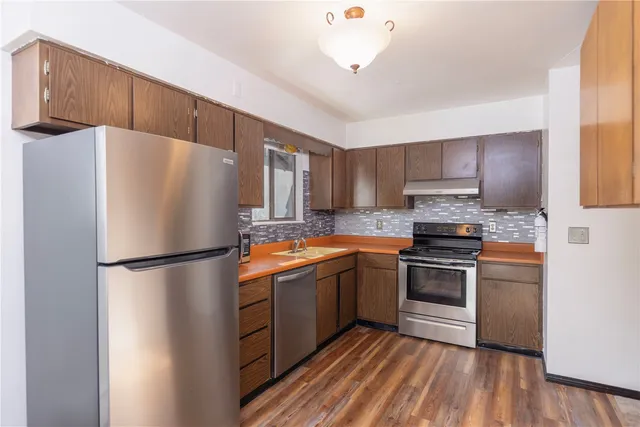 a white refrigerator freezer sitting in a kitchen