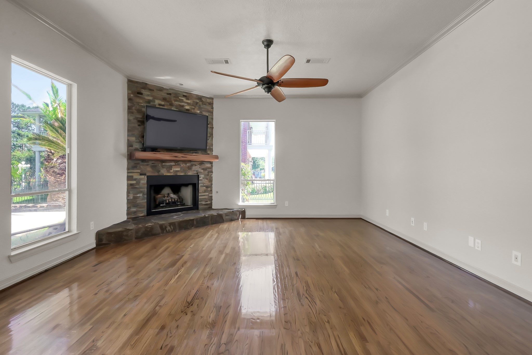12758 Aries Loop Willis, TX 77318 - Photo 13 of 48 Living Area has Beautiful Hardwood Flooring and Gas Log Fireplace