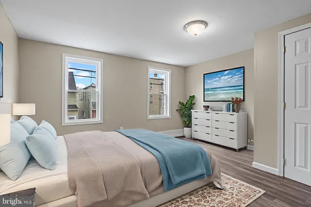 a bedroom with a bed and a dresser