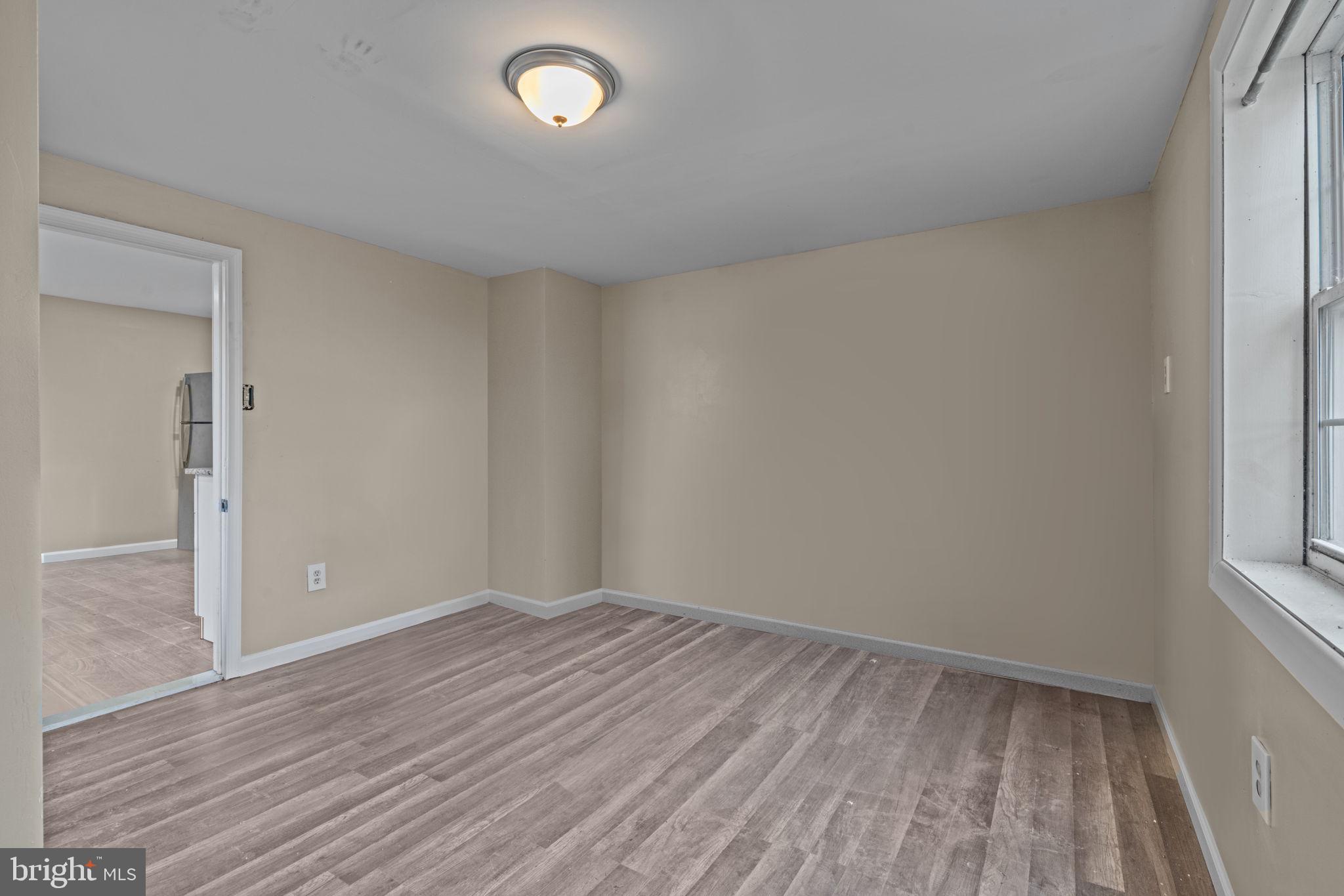 327 Mercer Street Gloucester City, NJ 08030 - Photo 9 of 19 wooden floor in an empty room