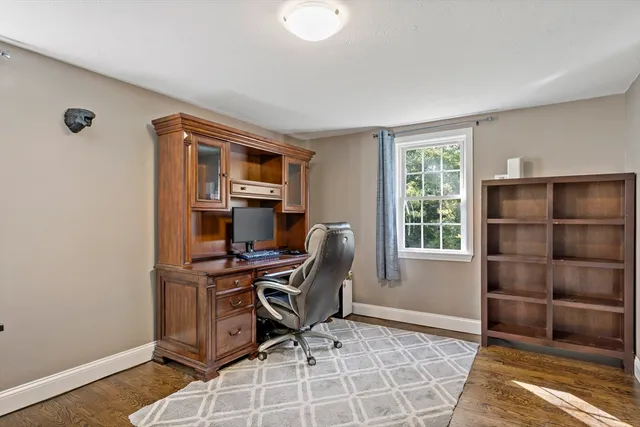 a workspace with furniture and window