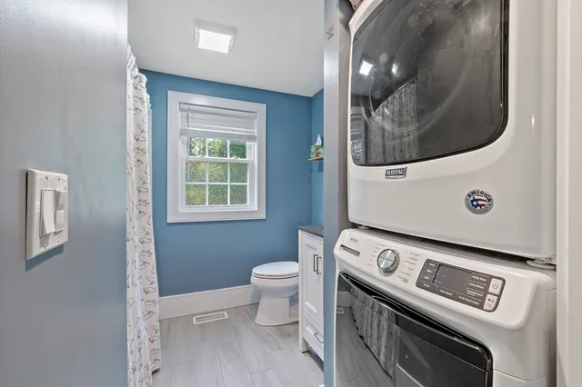 a view of a room with washer and dryer
