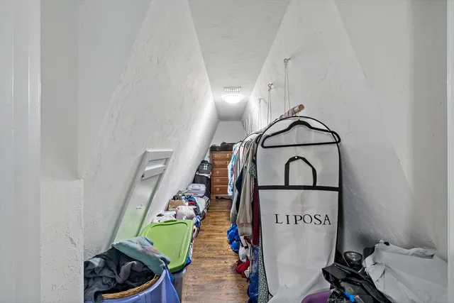 a view of an entryway with wooden floor