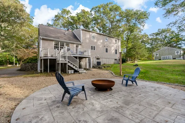 a view of a chair and table on the deck