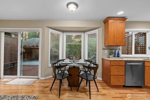 a view of a dining room with furniture window and outside view