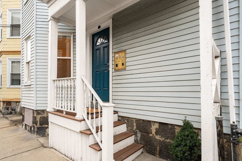 3 Spring Garden Street, Unit 1 Boston, MA 02125 - Photo 18 of 23 a view of a house with a white door