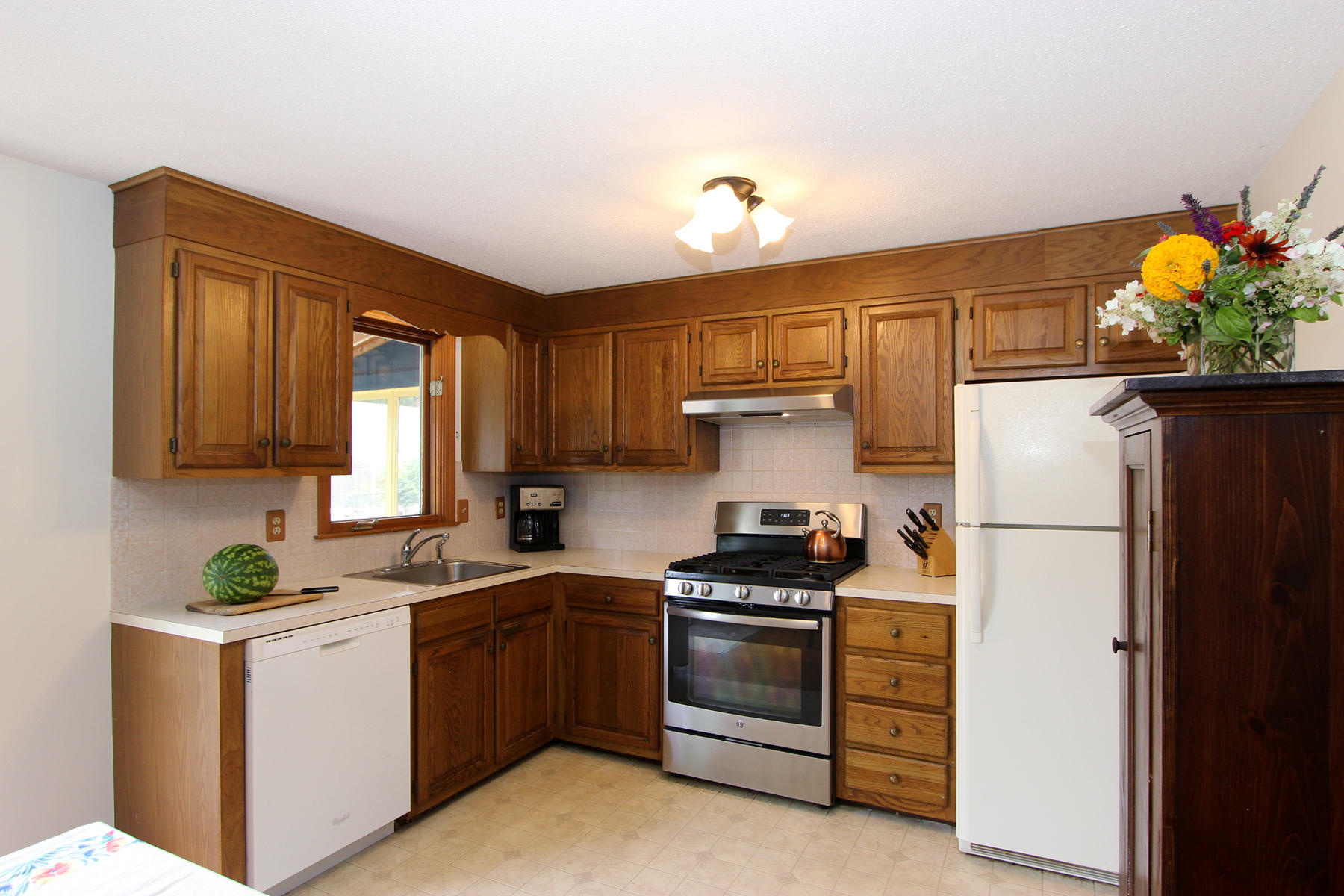 58 Colburne Path West Yarmouth, MA 02673 - Photo 11 of 39 a kitchen with stainless steel appliances a refrigerator sink stove microwave and cabinets