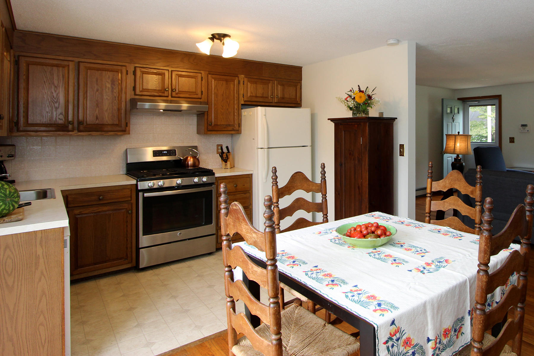58 Colburne Path West Yarmouth, MA 02673 - Photo 12 of 39 a kitchen with stainless steel appliances kitchen island a table chairs and refrigerator