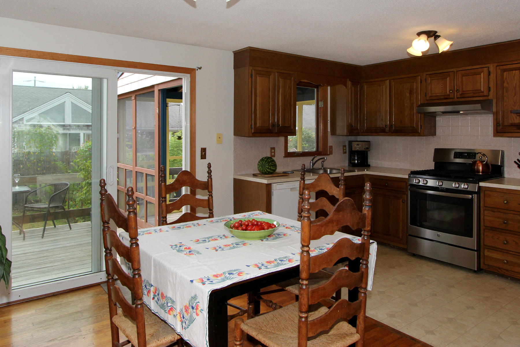 58 Colburne Path West Yarmouth, MA 02673 - Photo 14 of 39 a kitchen with a stove a sink and a refrigerator