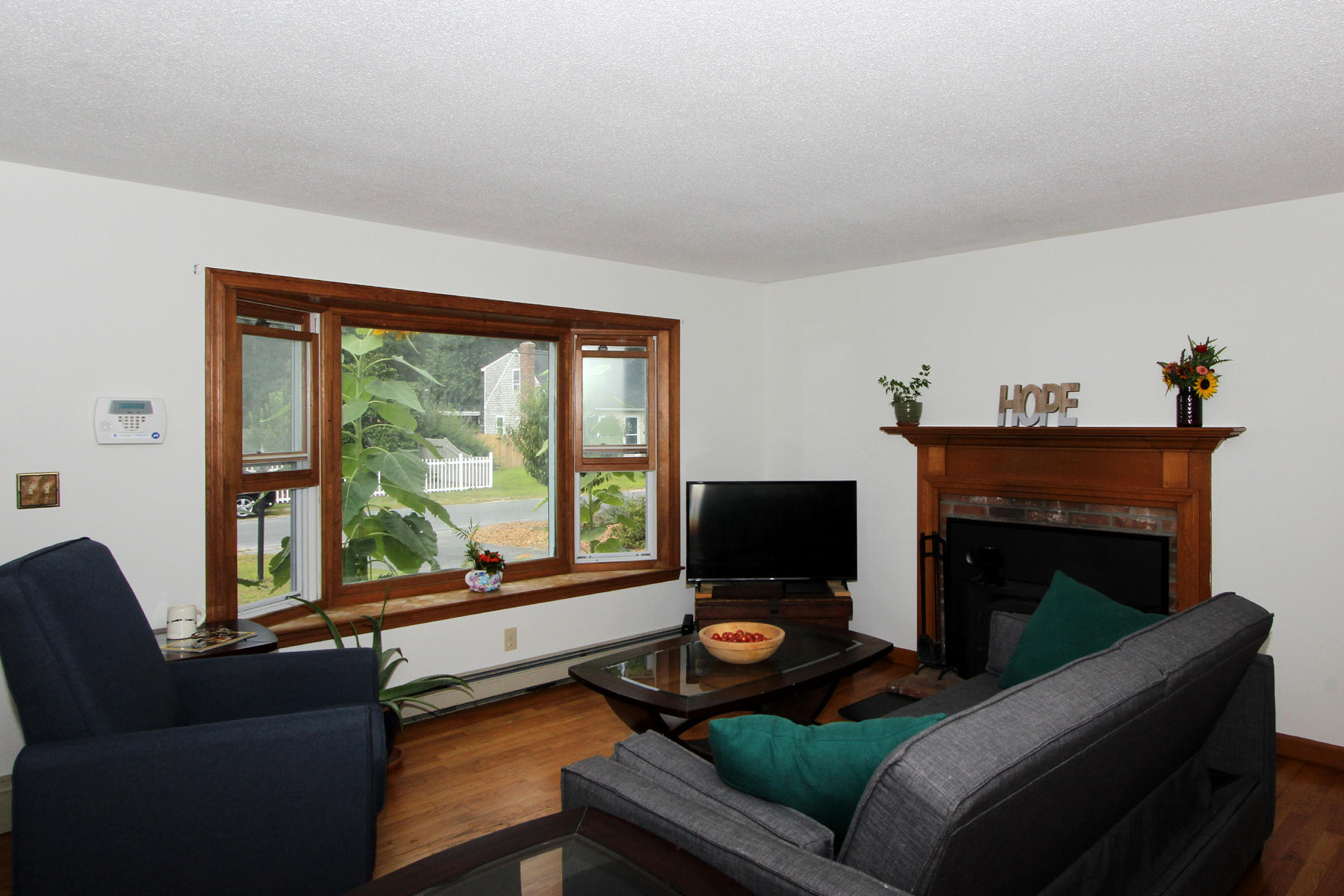 58 Colburne Path West Yarmouth, MA 02673 - Photo 19 of 39 a living room with furniture and a fireplace