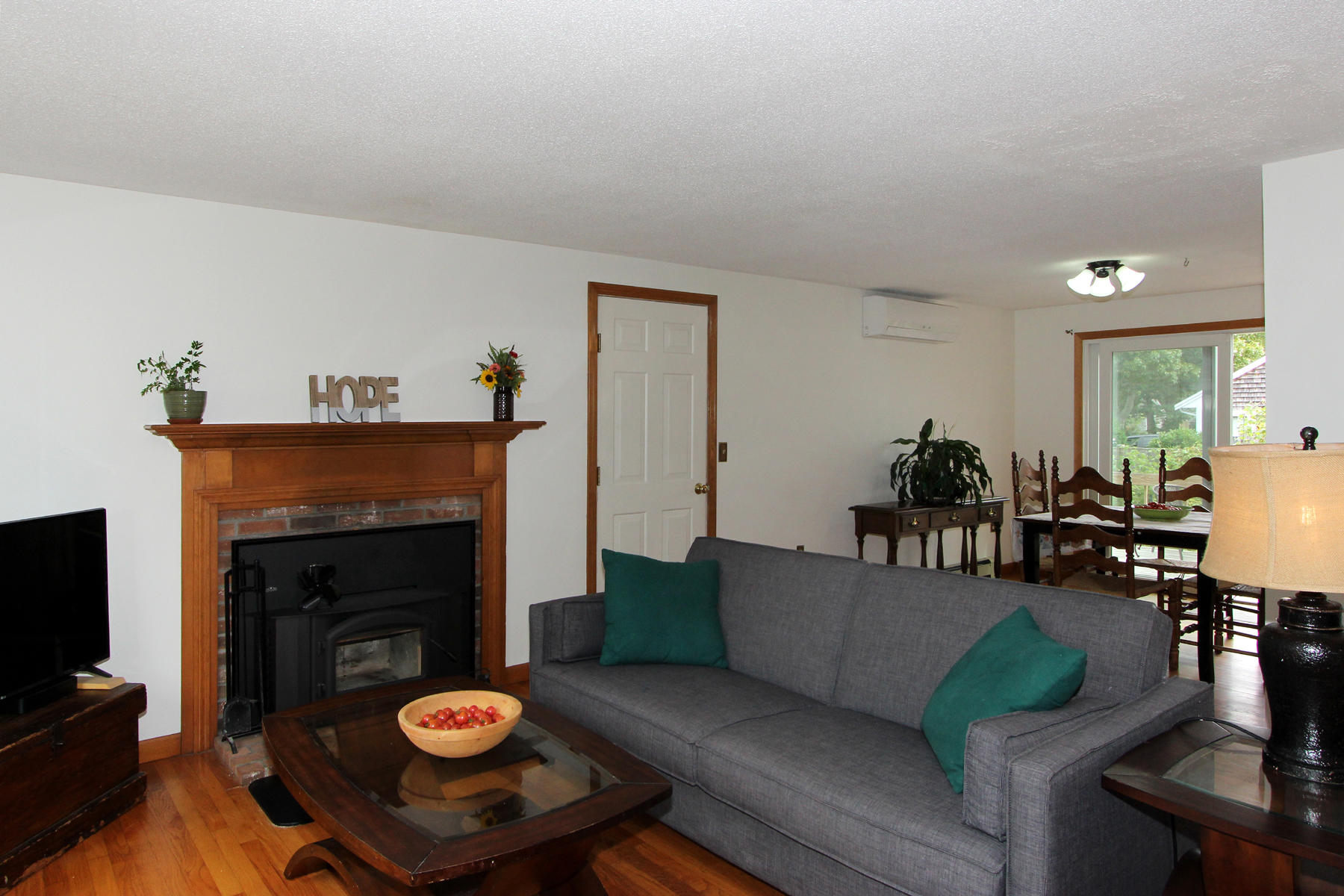 58 Colburne Path West Yarmouth, MA 02673 - Photo 21 of 39 a living room with furniture and a fireplace