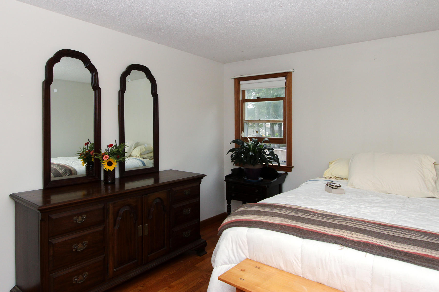 58 Colburne Path West Yarmouth, MA 02673 - Photo 24 of 39 a bedroom with a bed and a dresser