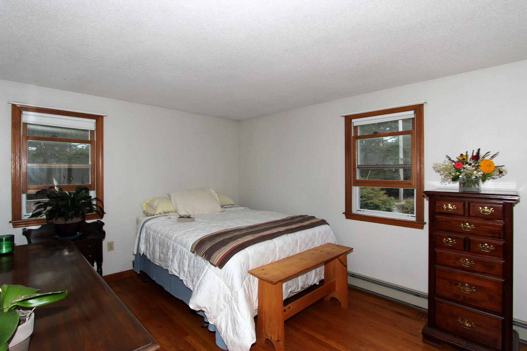 58 Colburne Path West Yarmouth, MA 02673 - Photo 28 of 39 a bedroom with a bed a dresser and window