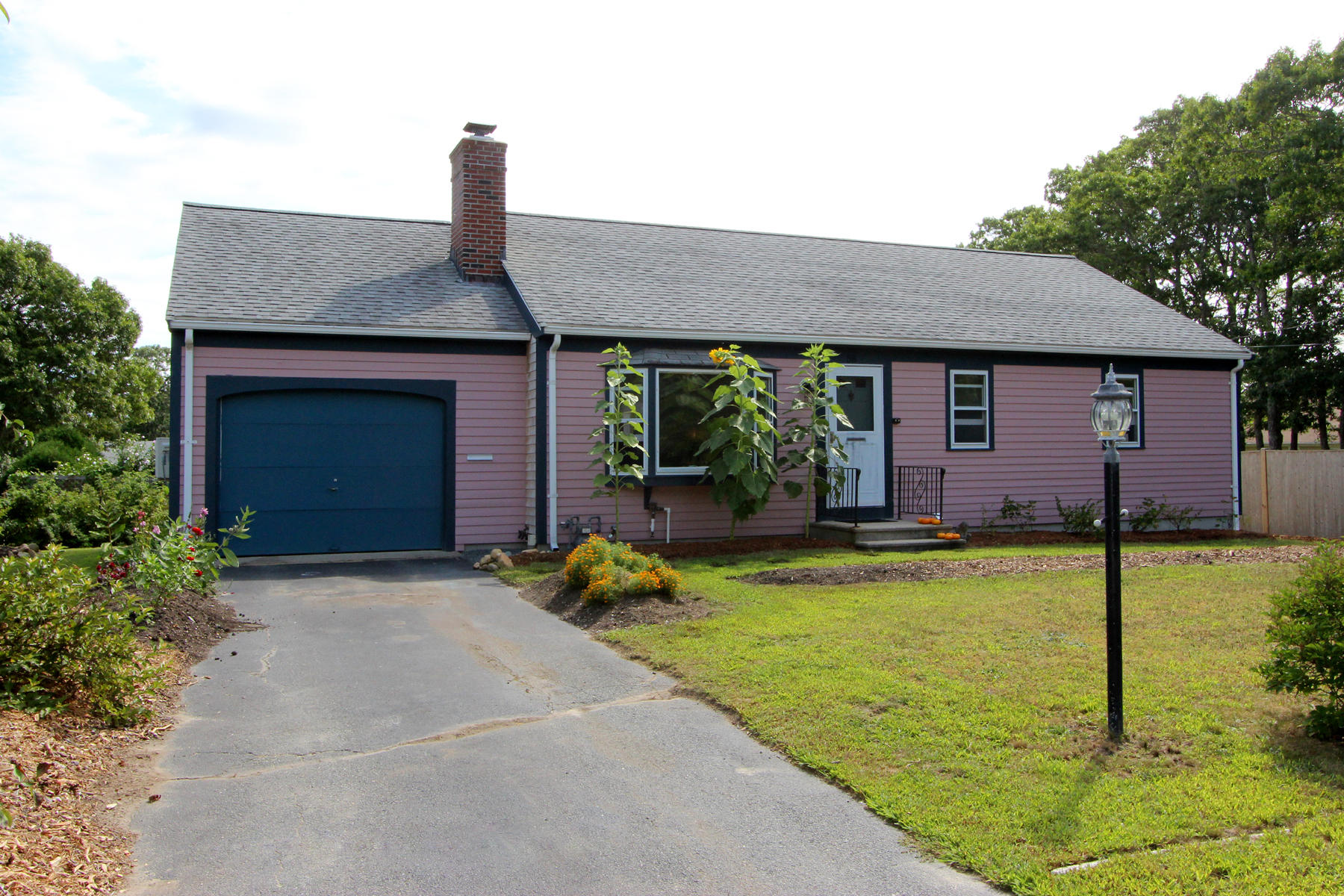 58 Colburne Path West Yarmouth, MA 02673 - Photo 3 of 39 a front view of house with yard and swimming pool