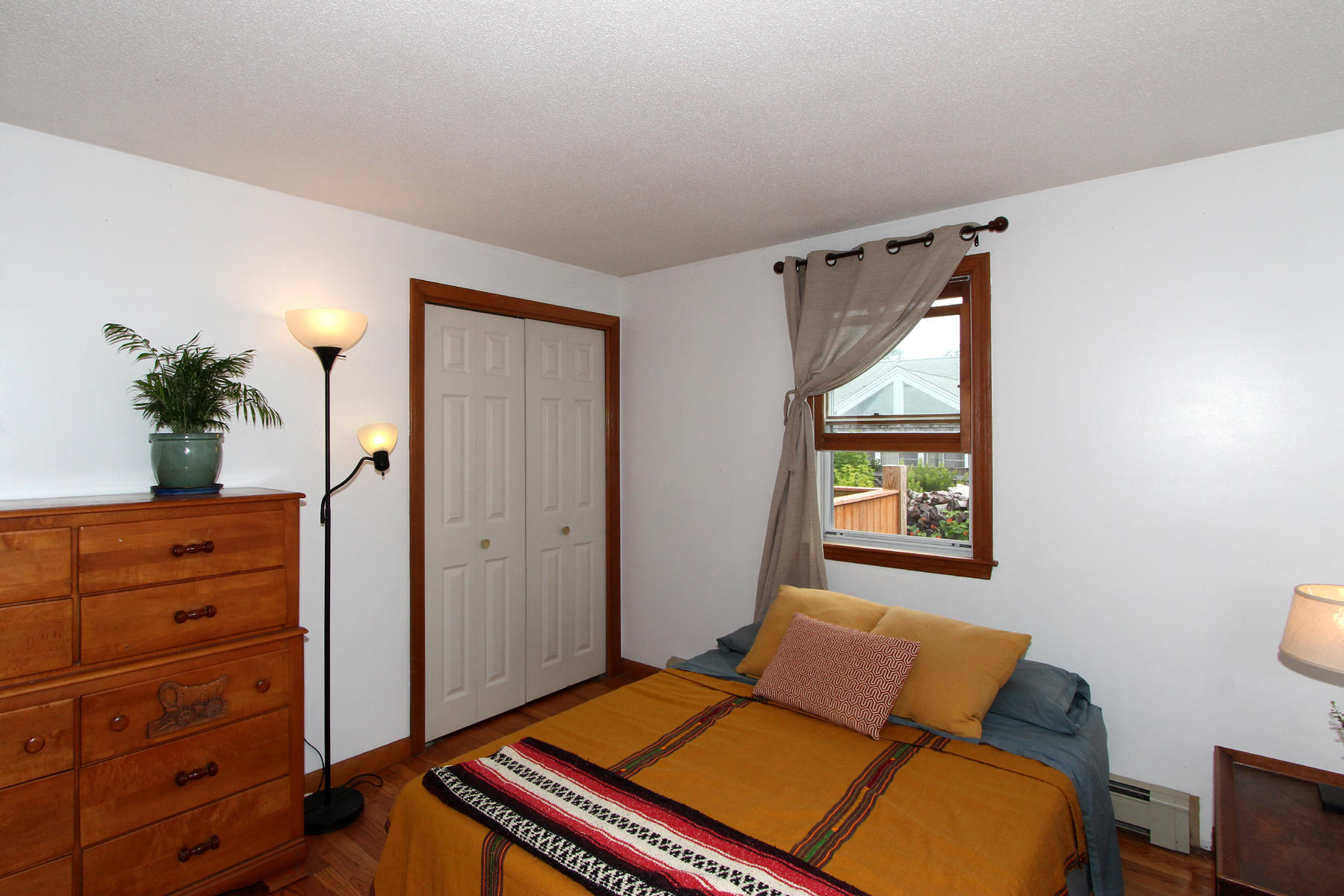 58 Colburne Path West Yarmouth, MA 02673 - Photo 32 of 39 a bedroom with a bed and a dresser