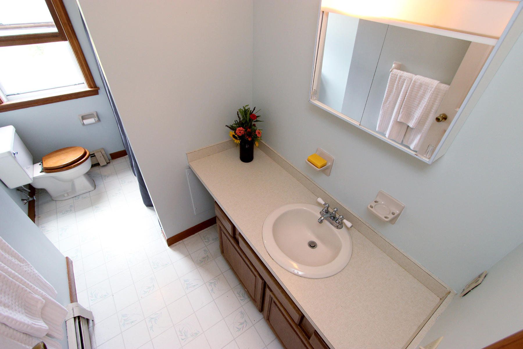 58 Colburne Path West Yarmouth, MA 02673 - Photo 35 of 39 a bathroom with a sink a mirror and a toilet