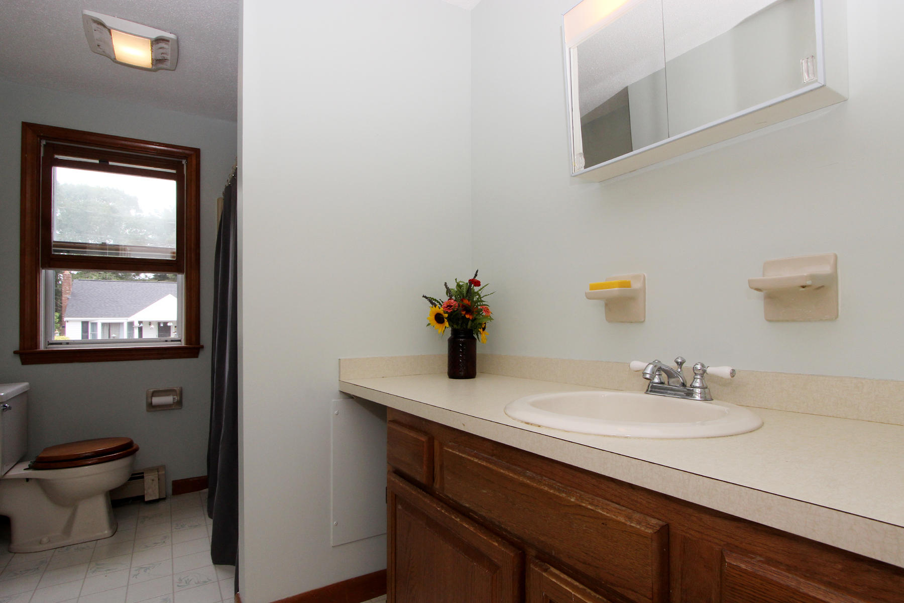 58 Colburne Path West Yarmouth, MA 02673 - Photo 36 of 39 a bathroom with a sink a toilet and mirror