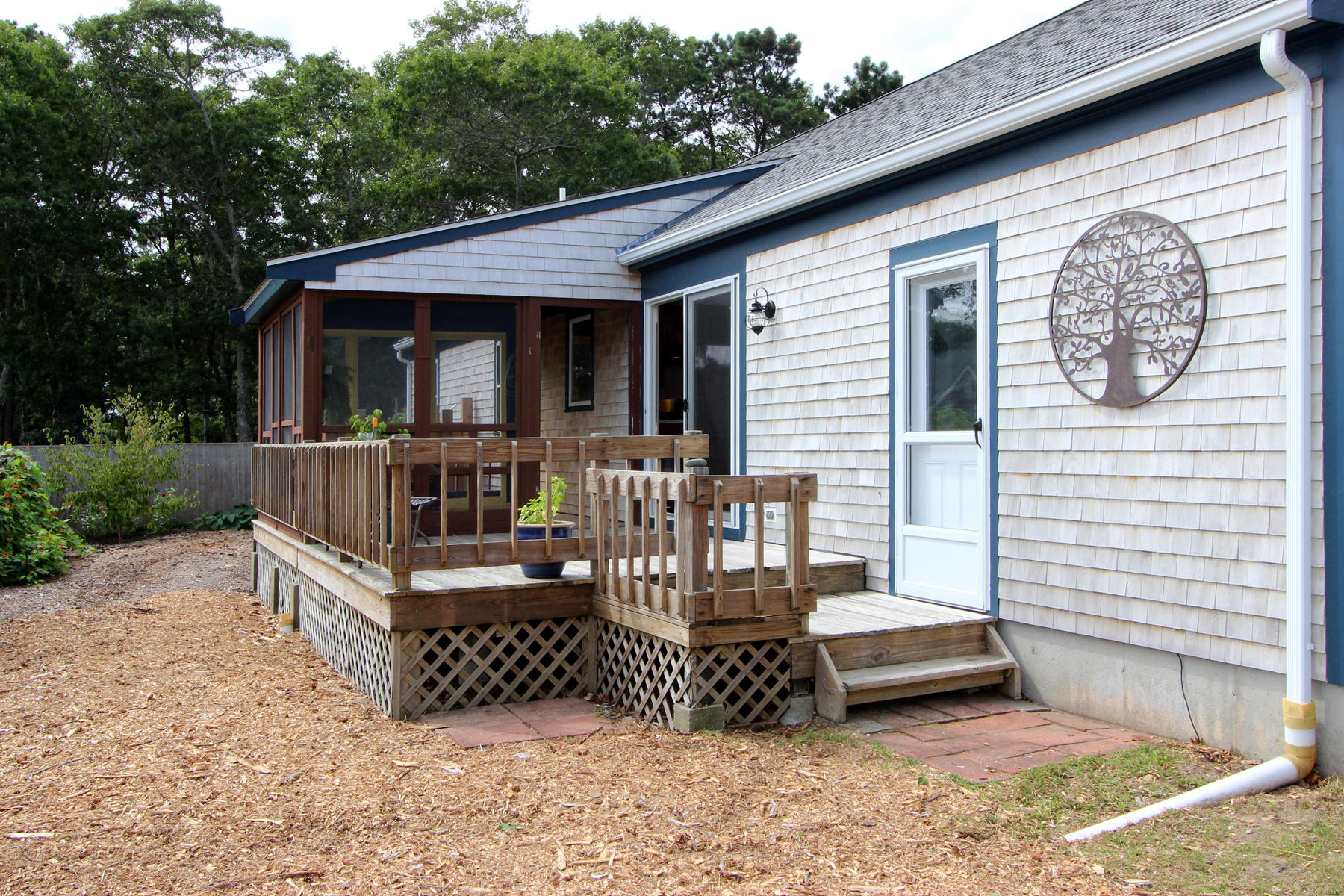 58 Colburne Path West Yarmouth, MA 02673 - Photo 9 of 39 a view of a house with wooden deck and furniture