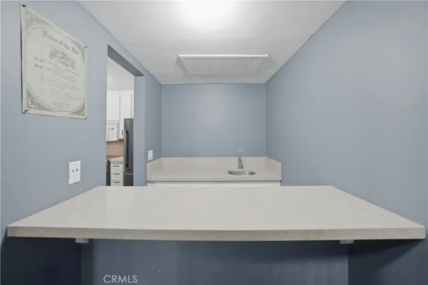 a bathroom with a sink a mirror and a shower