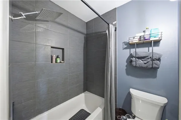 a bedroom with a bed and a cabinets