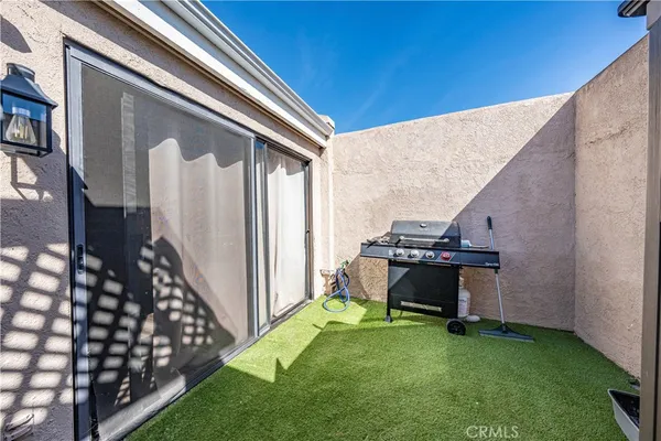 a view of a backyard with a table and chair