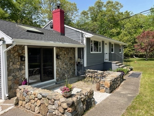 6 Hickey Road Hingham, MA 02043 - Photo 3 of 23 a front view of a house with a yard