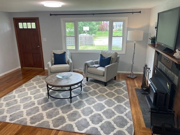6 Hickey Road Hingham, MA 02043 - Photo 9 of 23 a living room with furniture a flat screen tv and a window