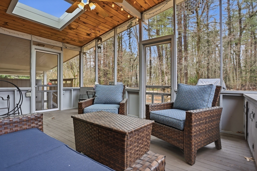 69 Robbins Road Sudbury, MA 01776 - Photo 29 of 35 a living room with furniture and a floor to ceiling window