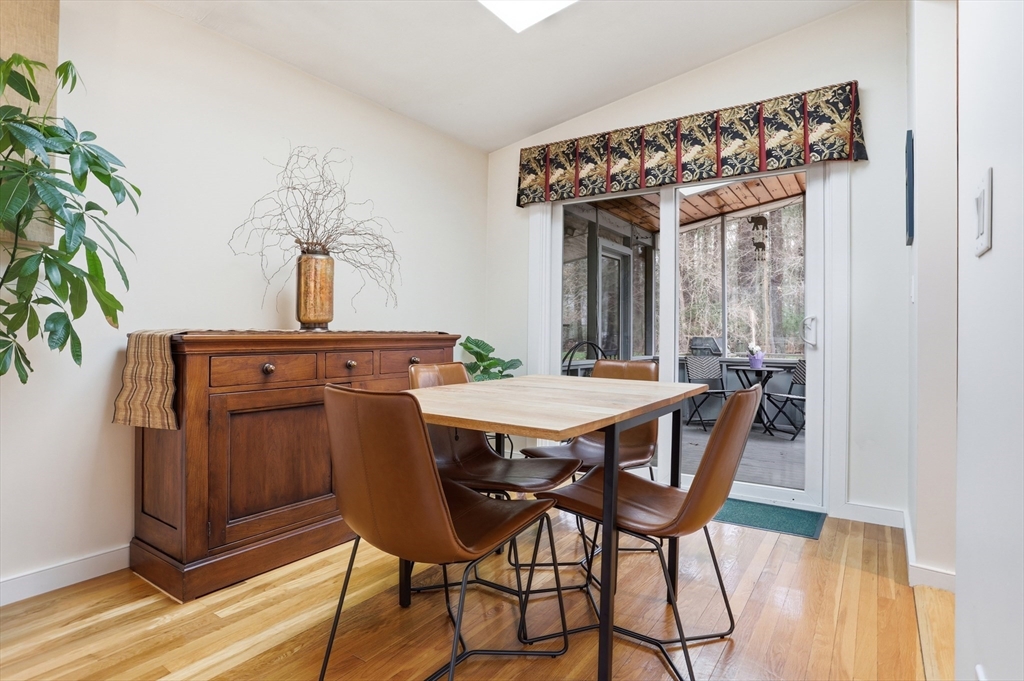 69 Robbins Road Sudbury, MA 01776 - Photo 7 of 35 a view of a dining room with furniture wooden floor and a chandelier