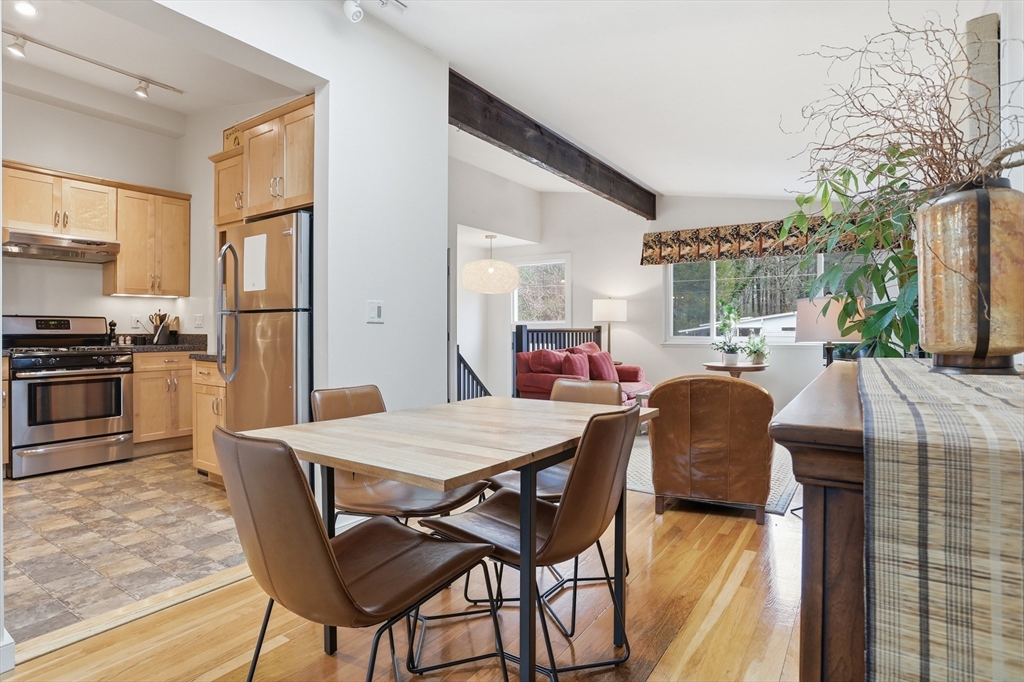 69 Robbins Road Sudbury, MA 01776 - Photo 9 of 35 a dining room with furniture and a kitchen view