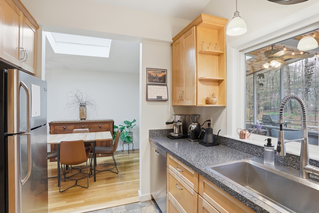 69 Robbins Road Sudbury, MA 01776 - Photo 10 of 35 a kitchen with a sink and a refrigerator