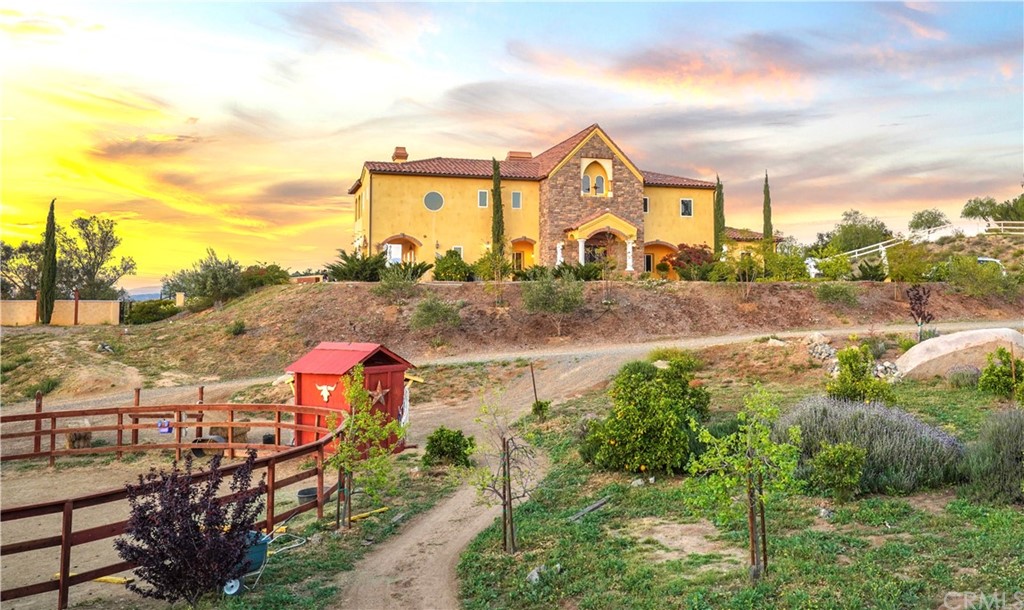 39150 Vía De Oro Temecula, CA 92592 - Photo 1 of 60 a front view of a house with a yard and mountain