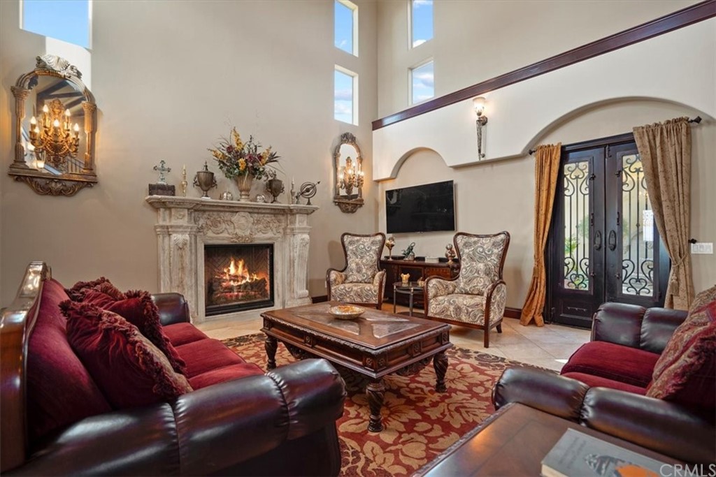 39150 Vía De Oro Temecula, CA 92592 - Photo 19 of 60 a living room with furniture and a fireplace