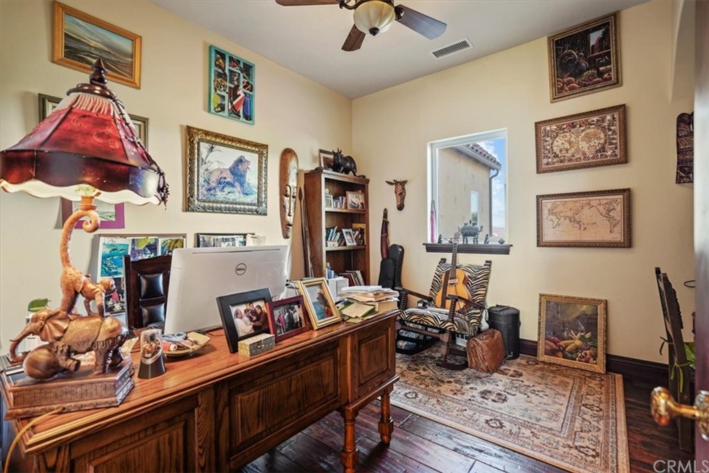 39150 Vía De Oro Temecula, CA 92592 - Photo 40 of 60 a room with furniture a rug and a window