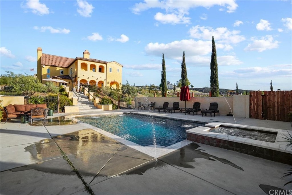 39150 Vía De Oro Temecula, CA 92592 - Photo 48 of 60 a view of a swimming pool with outdoor seating