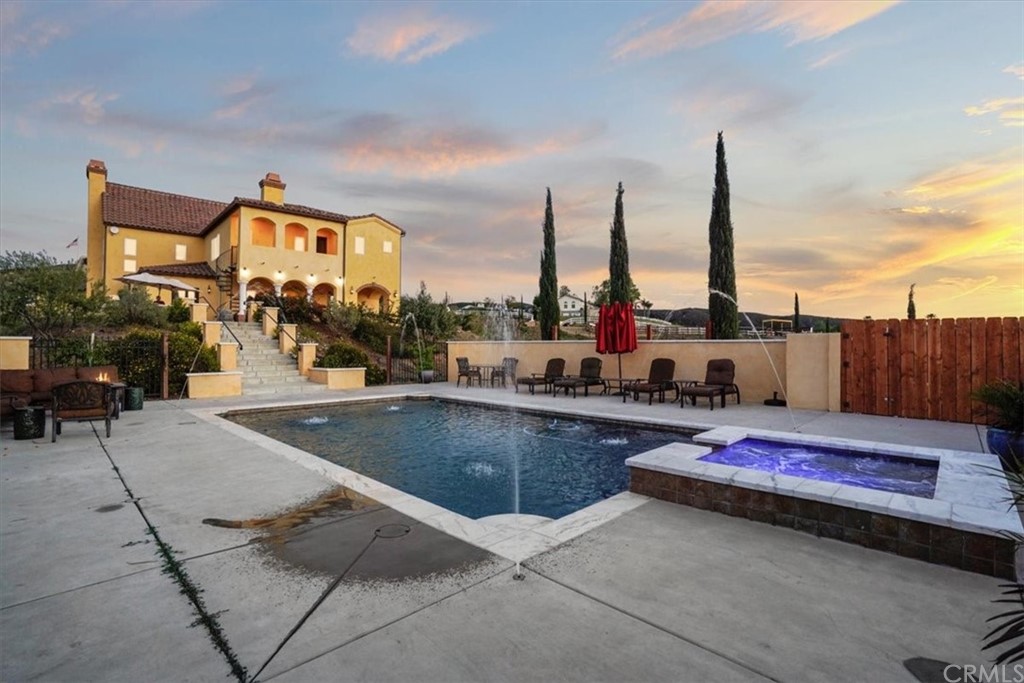 39150 Vía De Oro Temecula, CA 92592 - Photo 49 of 60 a swimming pool with outdoor seating