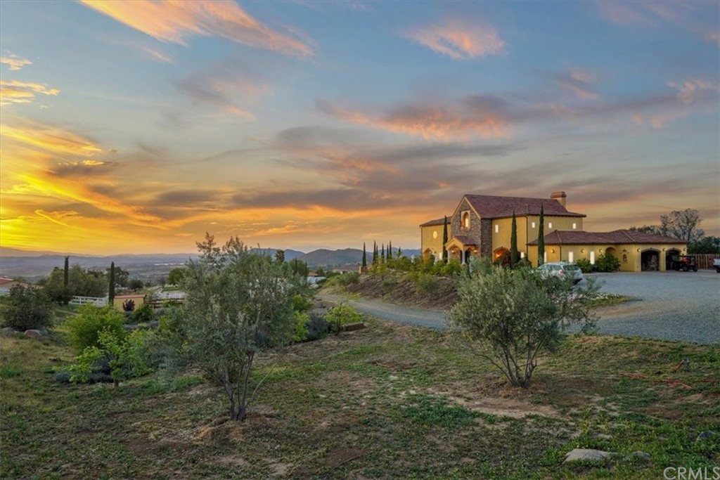 39150 Vía De Oro Temecula, CA 92592 - Photo 60 of 60 a view of a lake with houses in back