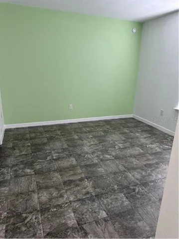 a view of a room that has a window in it