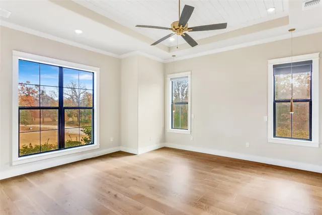 a bathroom with a tub a sink and a large mirror