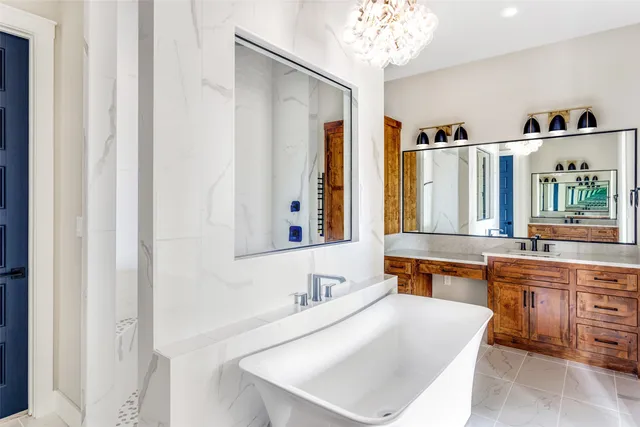 a bathroom with a granite countertop sink mirror and a