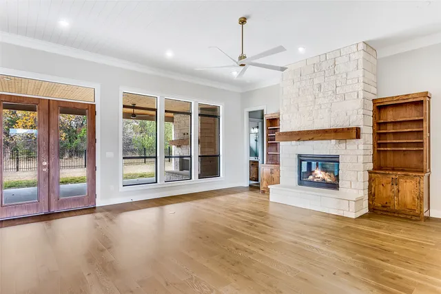 a view of large kitchen with a large window a sink and stainless steel appliances