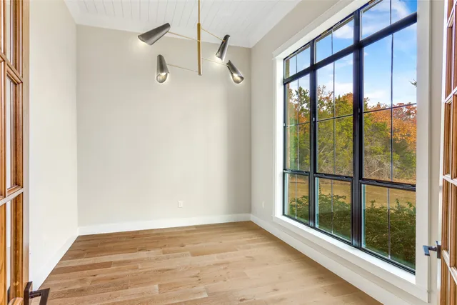 a spacious bathroom with a sink double vanity and a mirror